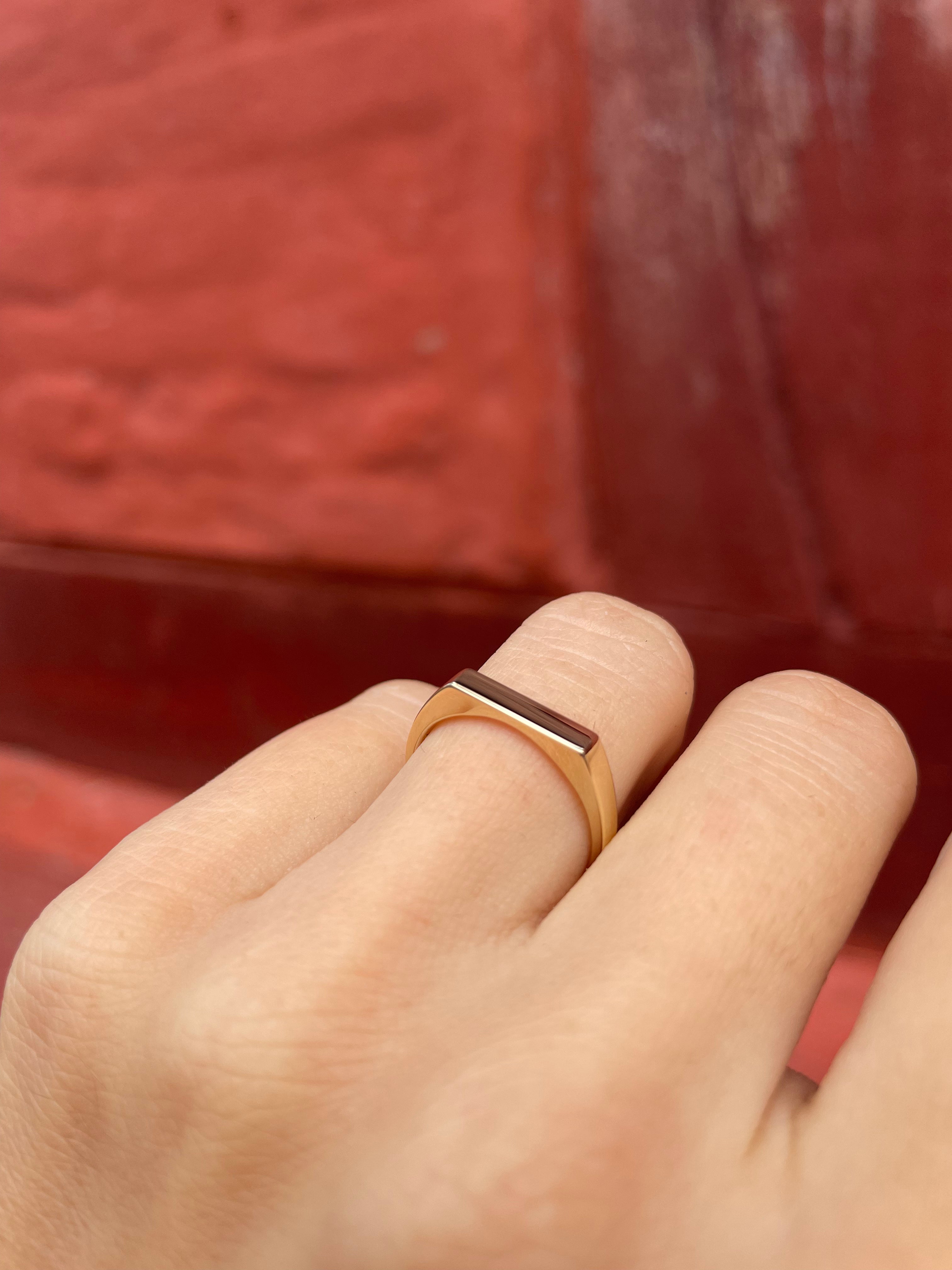 Small thin signet ring.